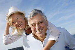 Portrait of cheerful senior couple having fun at the beach.jpeg