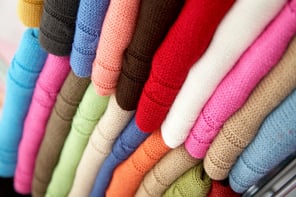 colourful clothes stacked in a retail store - woolen jumpers.jpeg